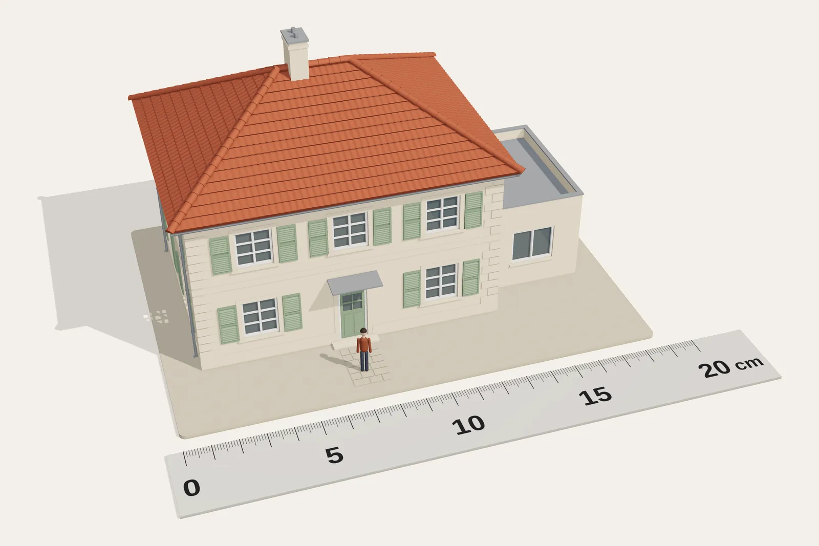 Image de synthèse : la maison d’exemple montée, à côté d’une règle graduée de 0 à 20 cm et d’un personnage à l’échelle HO ; sa façade de 10,40 m mesure 12 cm.